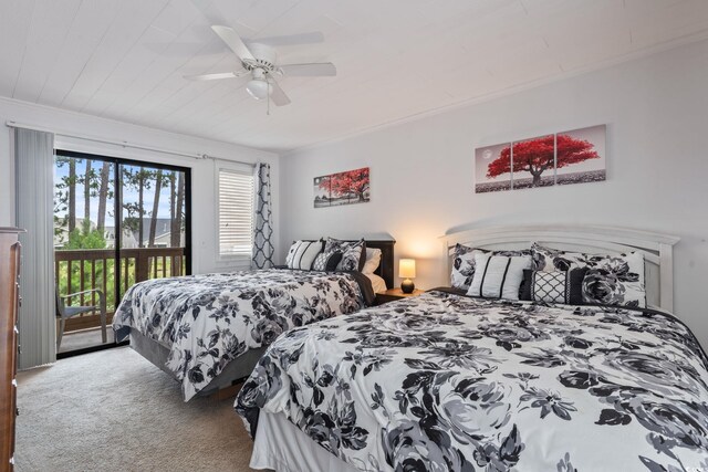 carpeted bedroom featuring ceiling fan, ornamental molding, and access to outside