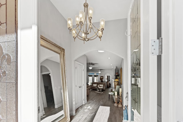 foyer entrance with wood-type flooring and ceiling fan