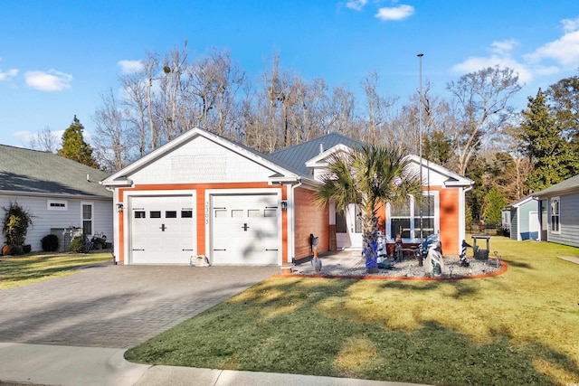 view of front of house with a garage and a front yard