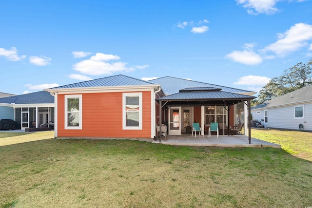 back of house with a yard, a patio area, and a gazebo