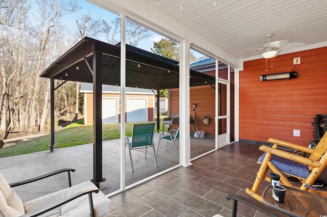 view of patio featuring ceiling fan