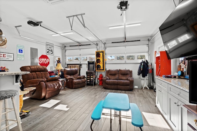 garage featuring a garage door opener and electric panel