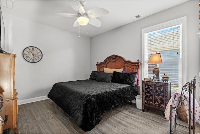 bedroom with wood-type flooring and ceiling fan