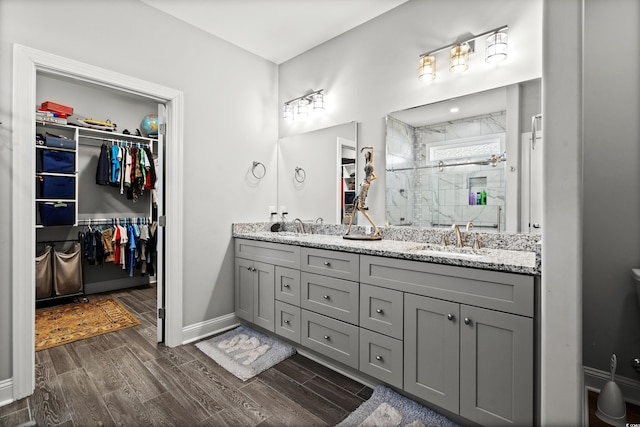 bathroom with vanity and a shower with shower door