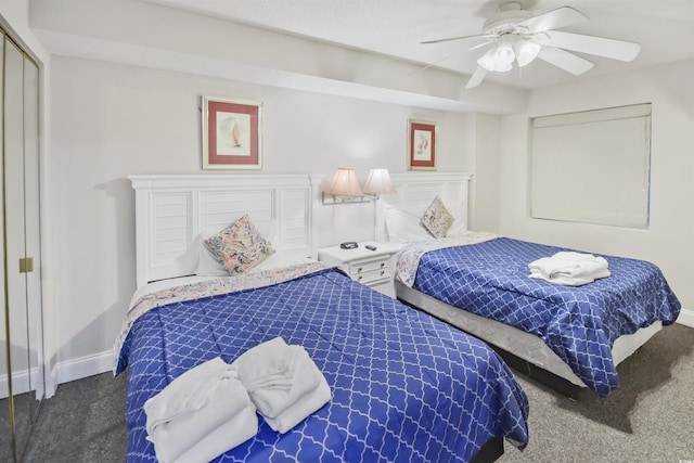 carpeted bedroom featuring ceiling fan and a closet