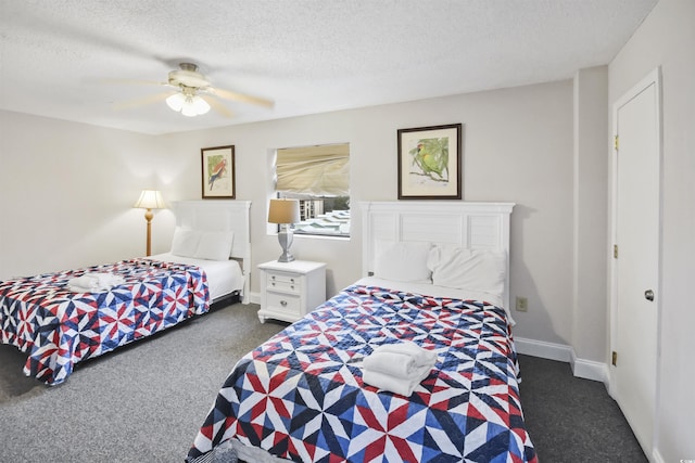 carpeted bedroom with ceiling fan and a textured ceiling