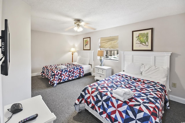 bedroom with ceiling fan, a textured ceiling, and dark colored carpet