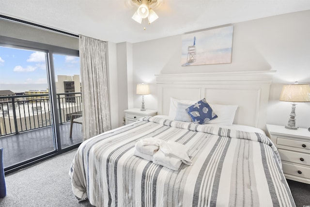 carpeted bedroom featuring ceiling fan and access to exterior