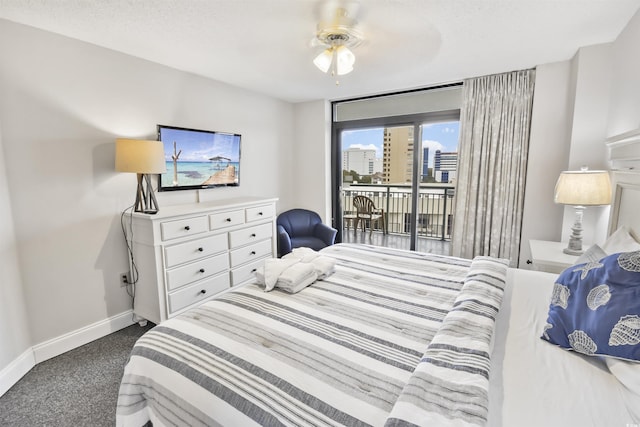 carpeted bedroom with ceiling fan, access to exterior, and a textured ceiling