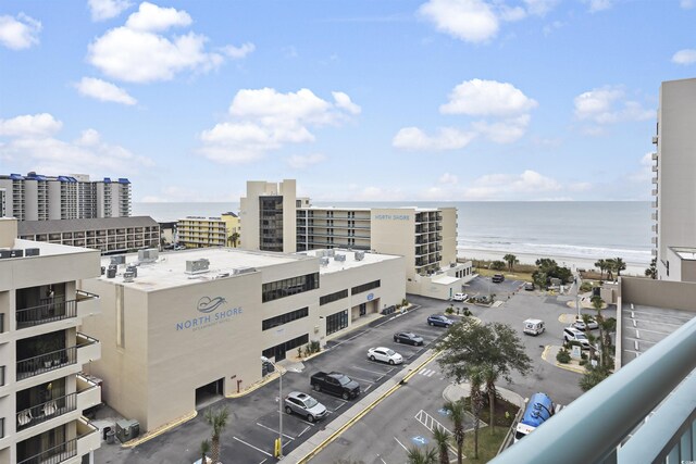 view of city with a water view and a beach view