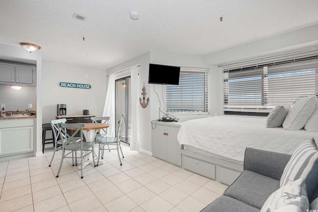 5905 S Kings Hwy Unit 908C, Myrtle Beach, SC 29575 - bedroom with light tile patterned floors and a textured ceiling