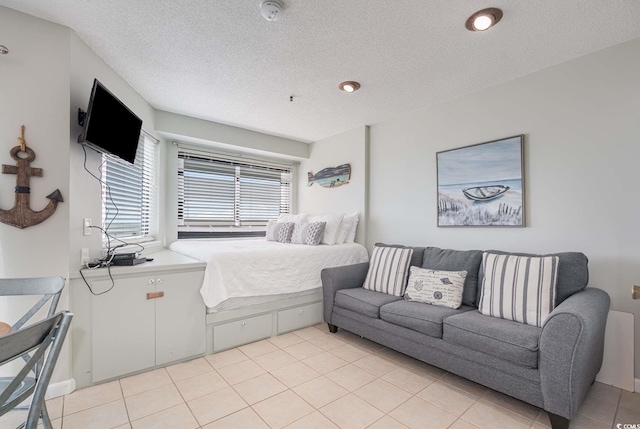 5905 S Kings Hwy Unit 908C, Myrtle Beach, SC 29575 - bedroom featuring light tile patterned flooring and a textured ceiling