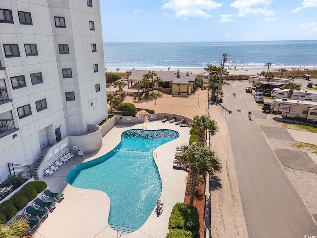 5905 S Kings Hwy Unit 908C, Myrtle Beach, SC 29575 - view of swimming pool featuring a patio, a water view, and a view of the beach