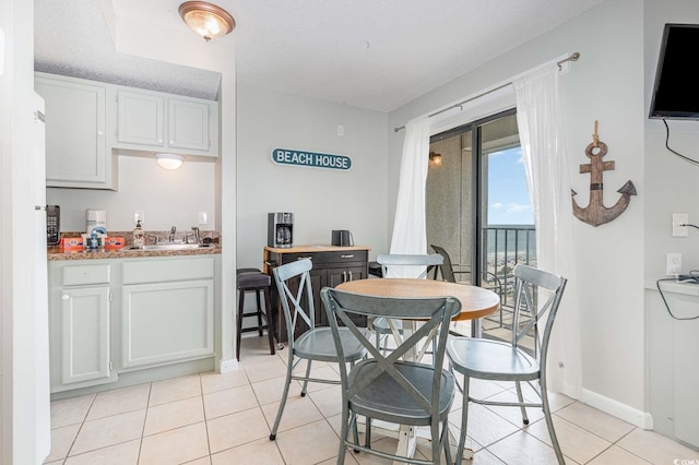 5905 S Kings Hwy Unit 908C, Myrtle Beach, SC 29575 - dining space with light tile patterned flooring and sink