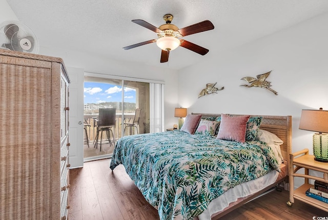 4560 Greenbriar Dr Unit 102-B, Little River, SC 29566 - bedroom with a ceiling fan, a textured ceiling, hardwood / wood-style flooring, and access to outside