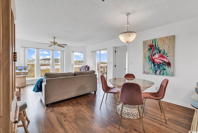 4560 Greenbriar Dr Unit 102-B, Little River, SC 29566 - dining room with baseboards, wood finished floors, ceiling fan, and a textured ceiling