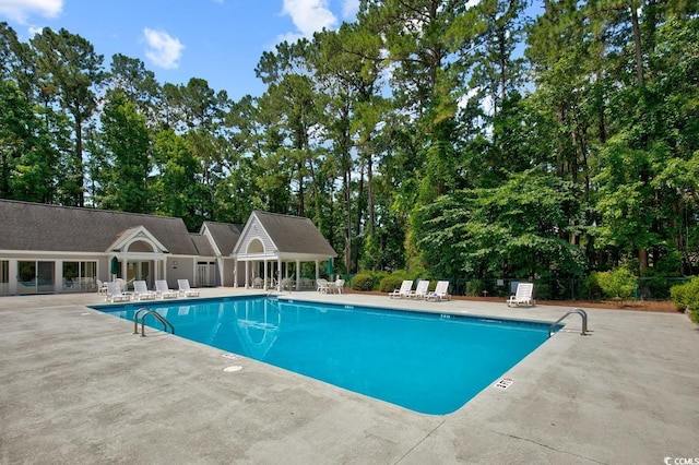 view of swimming pool with a patio area