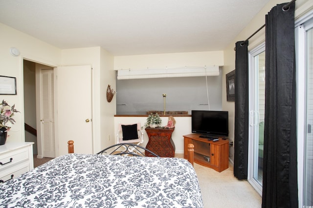 bedroom with light colored carpet