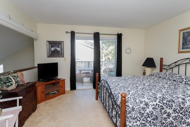 bedroom with light colored carpet, access to exterior, and a textured ceiling