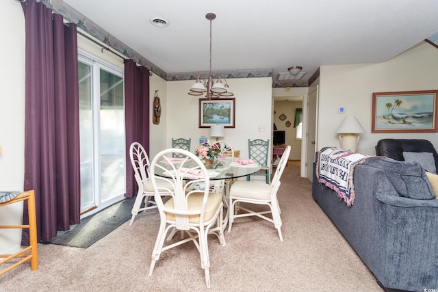 view of carpeted dining area