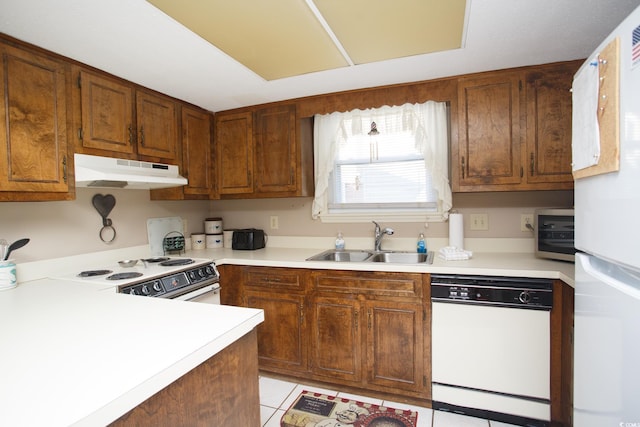 kitchen with sink and white appliances