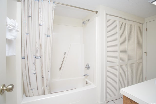 bathroom featuring vanity and shower / bathtub combination with curtain