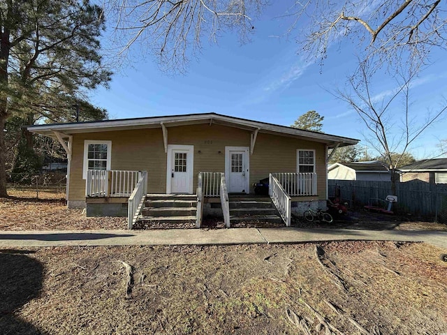 view of front of house featuring fence