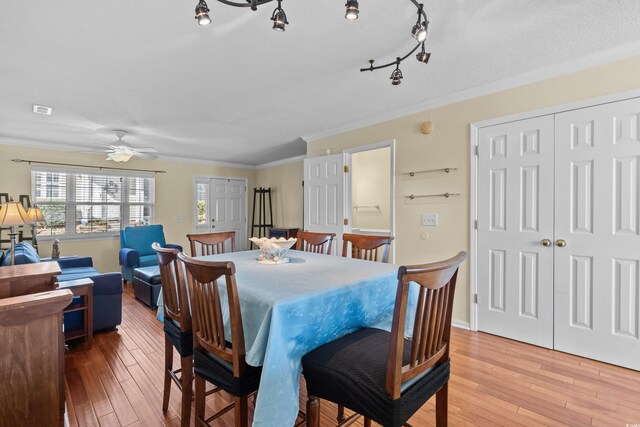 618 3rd Ave S Unit 4D, North Myrtle Beach, SC 29582 - dining area featuring crown molding, light wood-style floors, ceiling fan, and baseboards