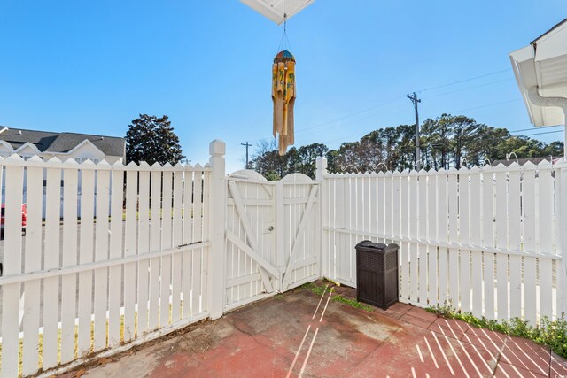 618 3rd Ave S Unit 4D, North Myrtle Beach, SC 29582 - view of patio with a gate, fence, and cooling unit