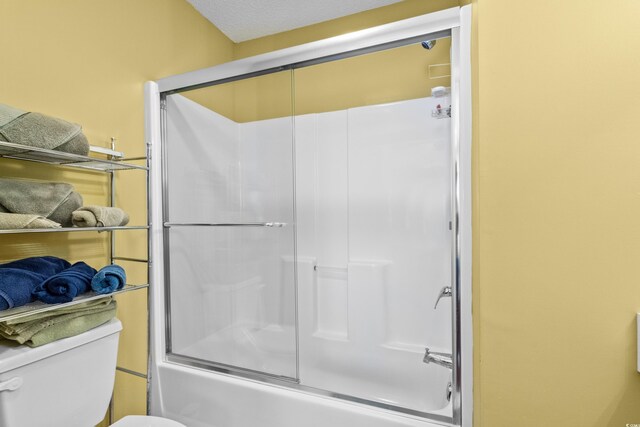 618 3rd Ave S Unit 4D, North Myrtle Beach, SC 29582 - bathroom featuring shower / bath combination with glass door and toilet