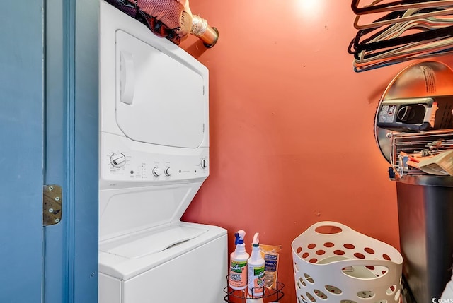 washroom with stacked washer and dryer