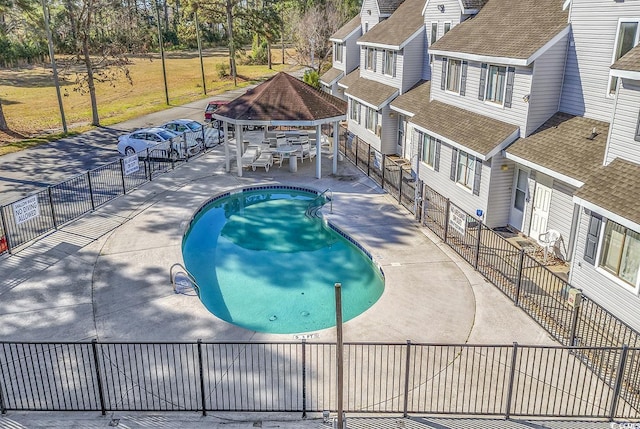 view of swimming pool featuring a gazebo and a patio area