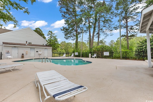 view of swimming pool featuring a patio area