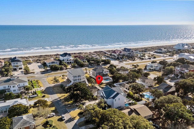 bird's eye view with a water view and a view of the beach