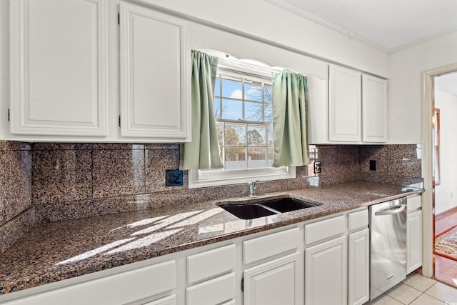 kitchen with white cabinetry, sink, stainless steel dishwasher, and crown molding