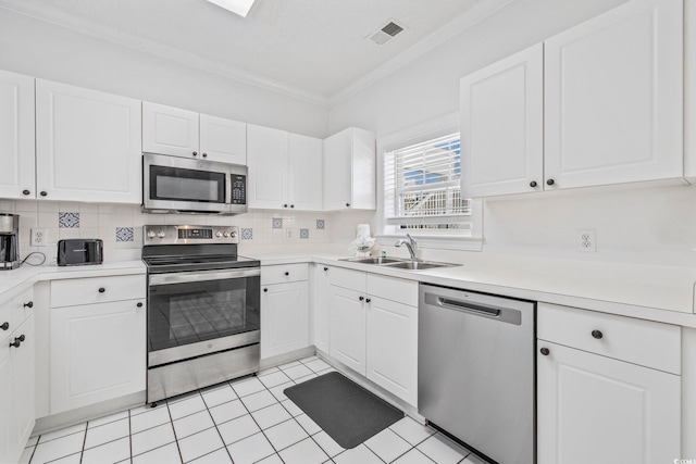 kitchen with sink, white cabinetry, and appliances with stainless steel finishes