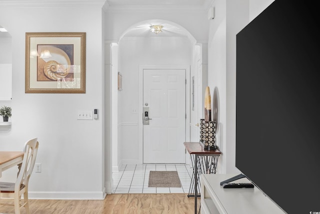 tiled entryway with crown molding