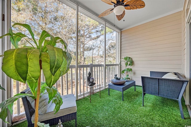 sunroom / solarium with ceiling fan