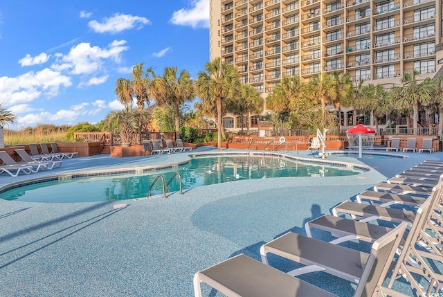 view of pool featuring a patio area and pool water feature