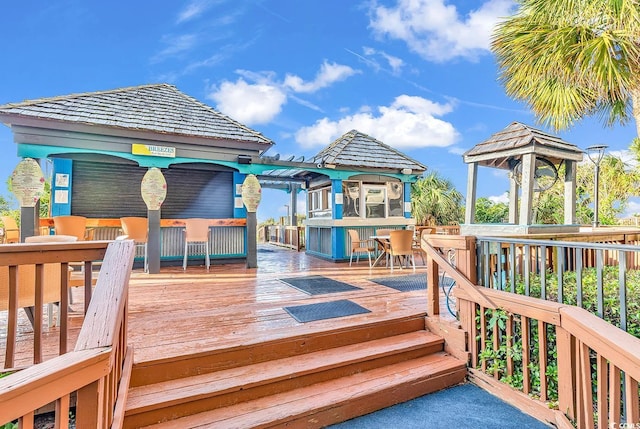 deck with a gazebo and an outdoor bar