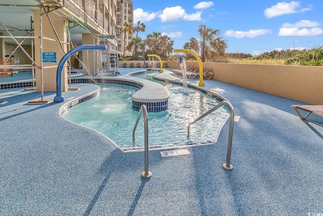 view of pool featuring pool water feature