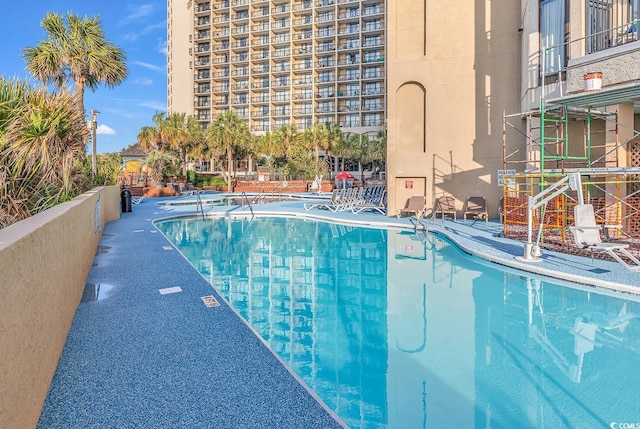 view of pool featuring a patio