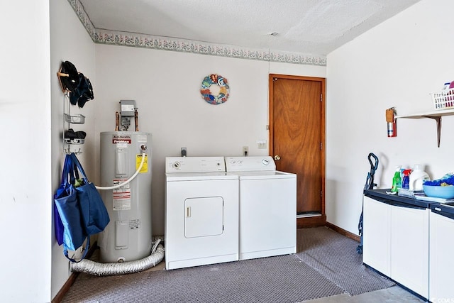 laundry area with carpet floors, electric water heater, a textured ceiling, separate washer and dryer, and laundry area