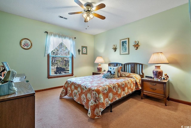 bedroom with carpet floors, visible vents, and baseboards