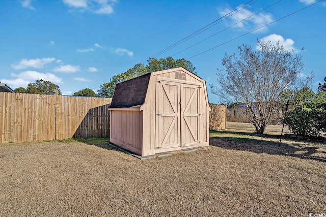 view of shed featuring a fenced backyard