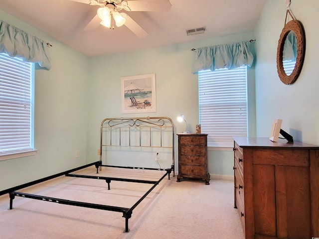 carpeted bedroom with ceiling fan