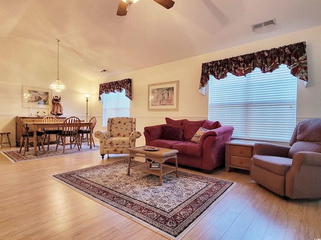 living room with ceiling fan and wood-type flooring