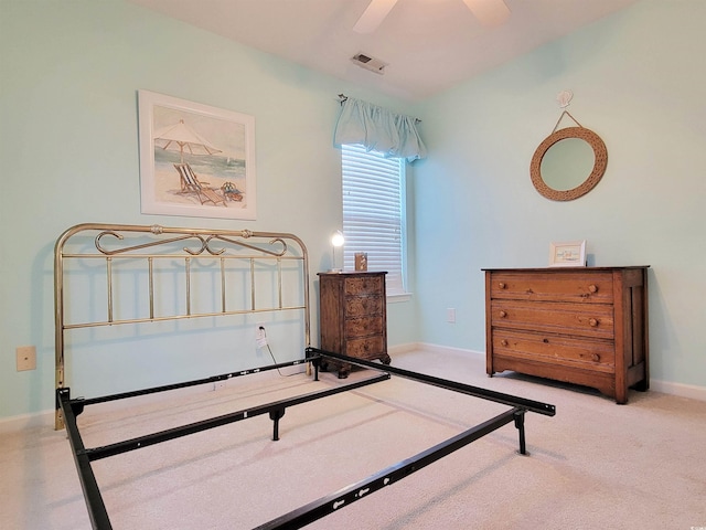 bedroom featuring light carpet and ceiling fan