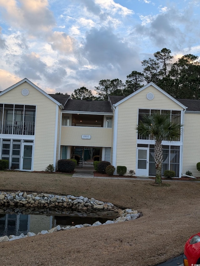 view of outdoor building at dusk