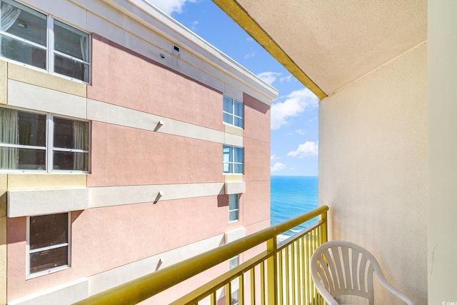 balcony featuring a water view